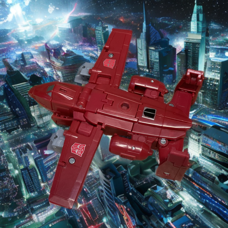 The Powerglide action figure fully transformed into its red A-10 Thunderbolt II-inspired jet mode, resting on its tucked-away landing gear.