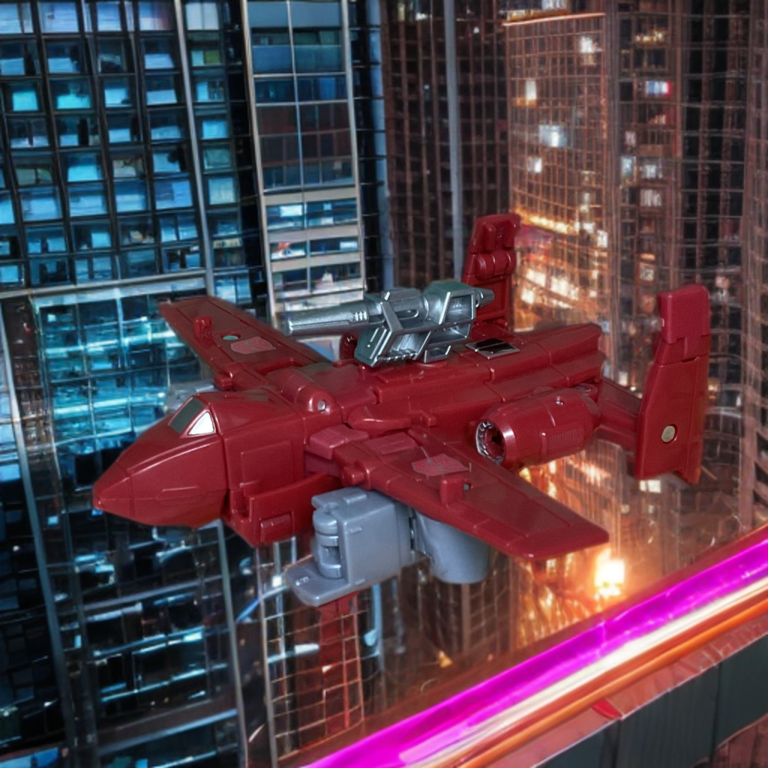 A side-angle shot of the Powerglide action figure in jet mode, resting cleanly on its landing gear with the blaster weapon mounted onto the top fuselage.