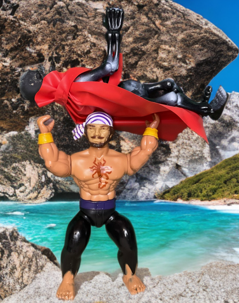 A ground-level, outdoor photograph of two retro-style action figures interacting on a beach.