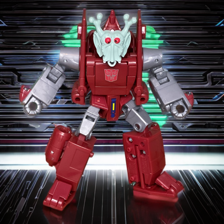 A tight macro shot of the Powerglide action figure in robot mode, wearing the specialized, slightly oversized cartoon mask accessory clipped securely over its face sculpt.