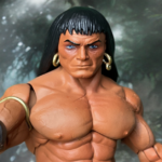 A detailed, muscular fantasy barbarian action figure inspired by Frank Frazetta's art style, featuring chiseled anatomy, long black hair, gold hoop earrings, a leather loincloth with a gold dagger, and an outstretched hand against a moody jungle backdrop.